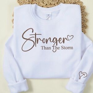 White Sweatshirt with Brown 'Stronger Than The Storm' Print